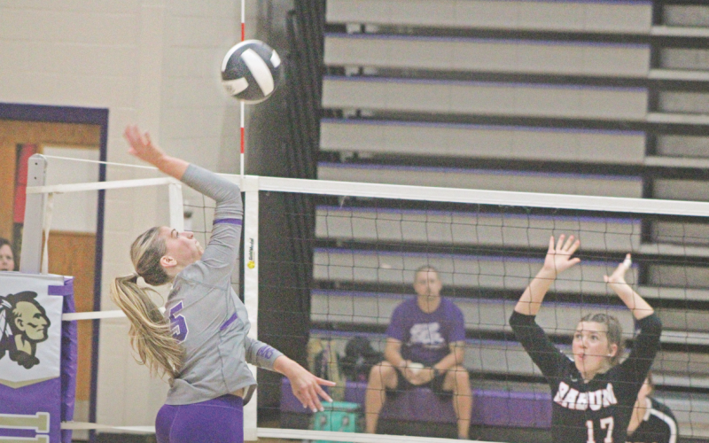 LCHS player Maddie Lee lands a spike against Rabun County.