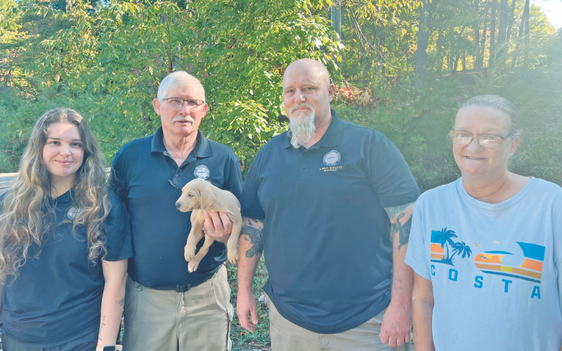 Pictured, from left, Animal Control Technicians Jeannie Knight and Tony Ashe, Animal Shelter Manager Wayne Marshall and River Flow Drive resident Melissa Bouchez are all in a more relaxed mood after rescuing a puppy from a nearby drainage pipe.