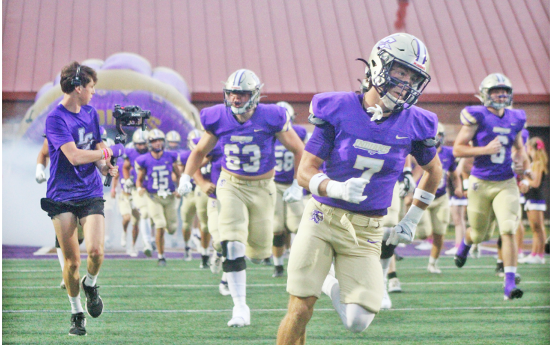 The Indians storm the field ahead of their game against Dunwoody.