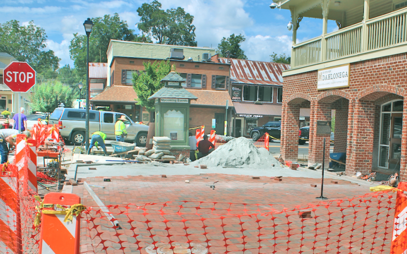 Workers with Hasbun Construction lay bricks on the plaza in front of the Visitors Center in downtown Dahlonega. The project is on schedule to be completed ahead of the busy Gold Rush festival in October.