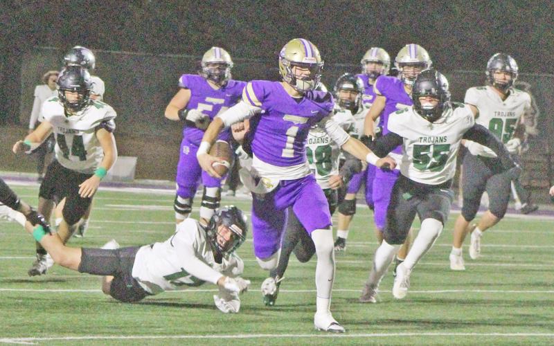 Senior Cal Faulkner hits a hole in North Hall’s defense and takes off during this week’s game.