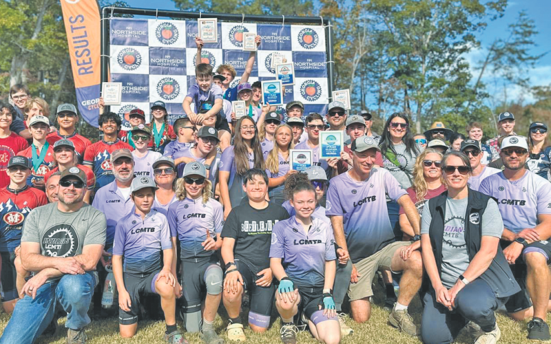 The Lumpkin Mountain Bike team gathers for a photo following a successful race at Yonah.
