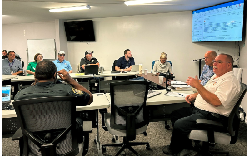 Local officials assembled in the bottom level of the downtown fire station last Thursday as they planned and prepared for the wind and rains of Hurricane Helene.