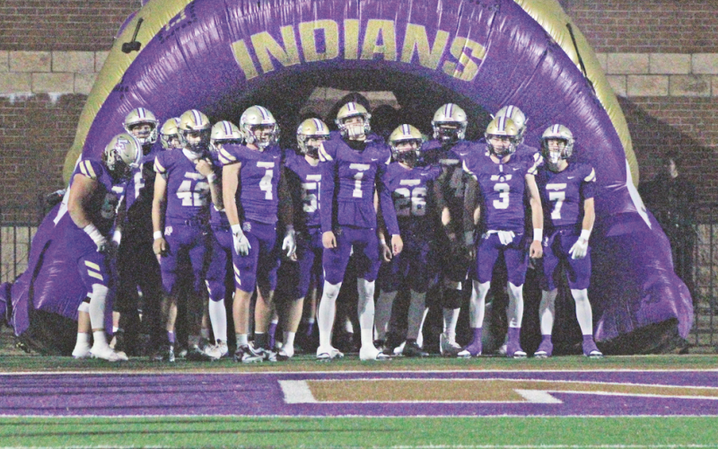 The Indians prepare to storm the field together ahead of their State Playoff game against LaGrange last Friday.