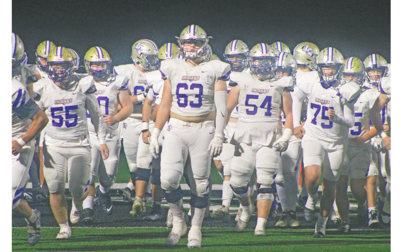 Zeke Cochran takes the field backed by the rest of the Indians at this week’s game in Pickens County.