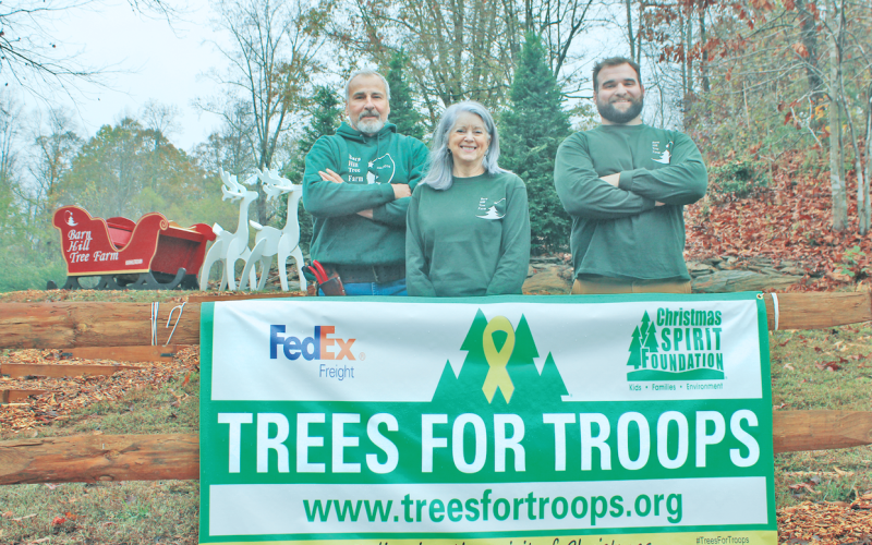 Barn Hill Tree Farm in Dahlonega is participating in the annual Trees for Troops charity program for the second year in a row. Pictured from left are Ed and Linda Mannino with their son, Matthew.