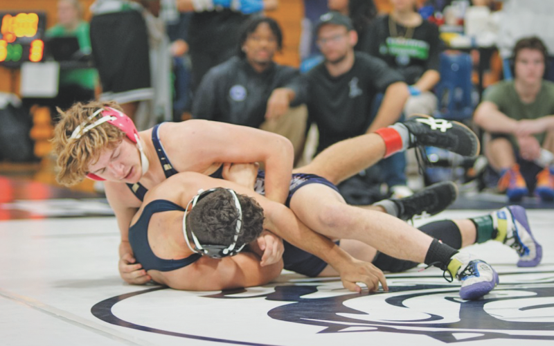 Lumpkin County wrestler Hunter Cook fights for positioning against his opponent.