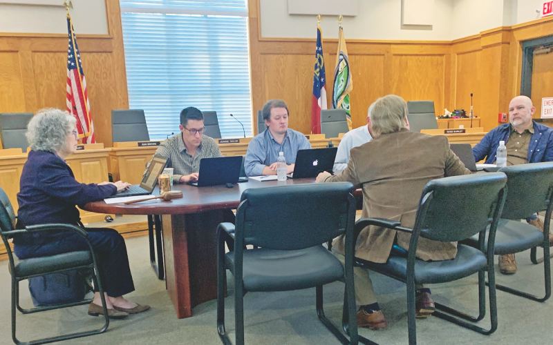 Members of the Dahlonega City Council discuss the merits of shifting back to the time-tested radio system for employee communication.