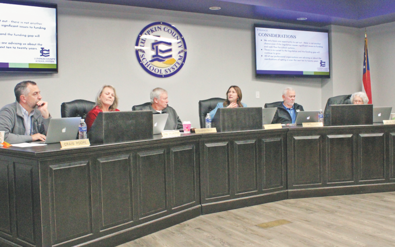 Superintendent Sharon Head explains her position on HB 581 as Board of Education members Craig Poore, Lynne Sylvester, Chairman Bobby Self, Jim McClure and Mera Turner weigh their options.