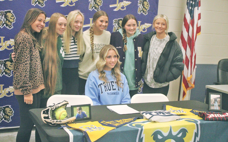 Lumpkin County softball player Julianna York celebrates her signing day alongside her teammates.