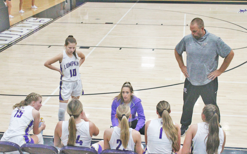 Head Coach Tess Wright talks things over with her Lumpkin County girls team.