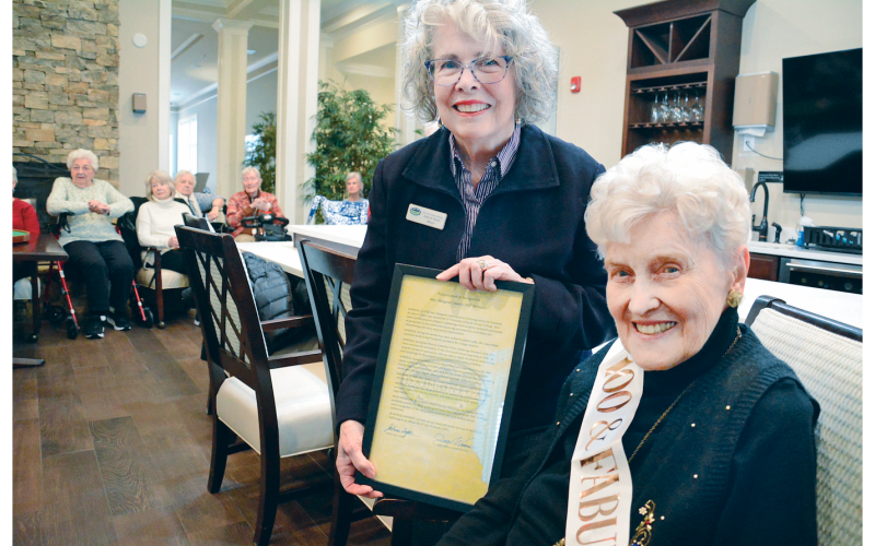 Mayor JoAnne Taylor presents a proclamation from the Dahlonega City Council on Margaret Owen’s 100th Birthday recognizing her for years of contributions to the local community.