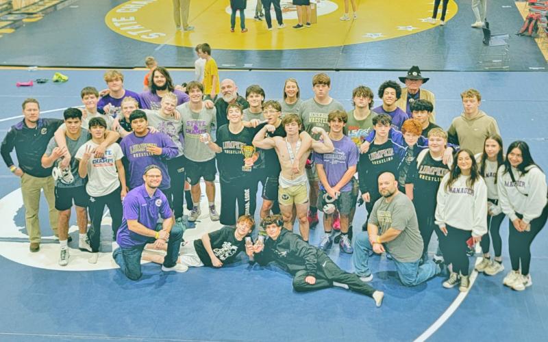 The Lumpkin County wrestling team celebrates their third place finish at the Class AAA State Dual Championships.