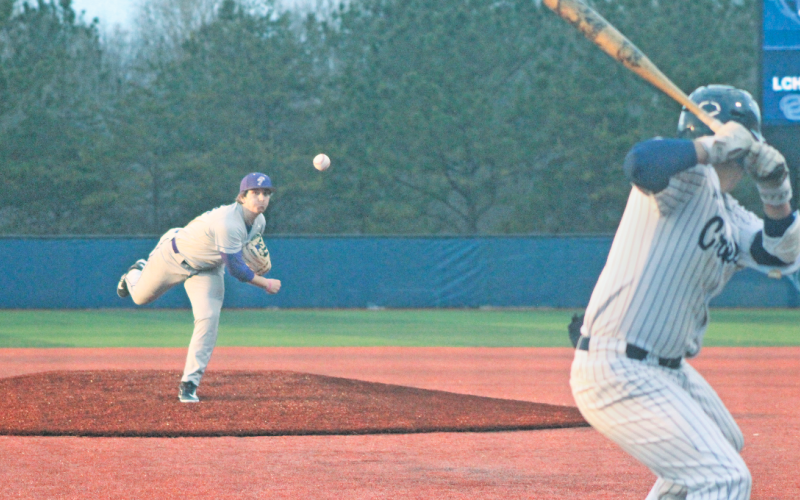 Jayzen Johnson delivers a pitch against Coahulla Creek.