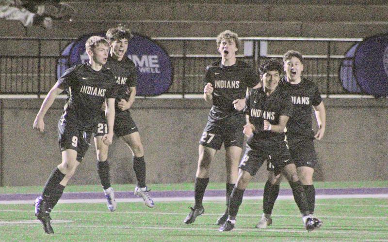 The Lumpkin County boys soccer team celebrates a goal against region rival White County.
