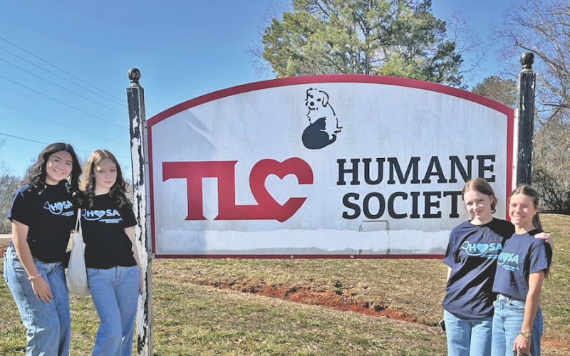 Lumpkin County High School sophomores (from left) Emma Rodriguez, Josie Tullis, Helana Tullis and Blakely Bell recently toured the Dahlonega TLC Humane Society as part of their HOSA student service project.