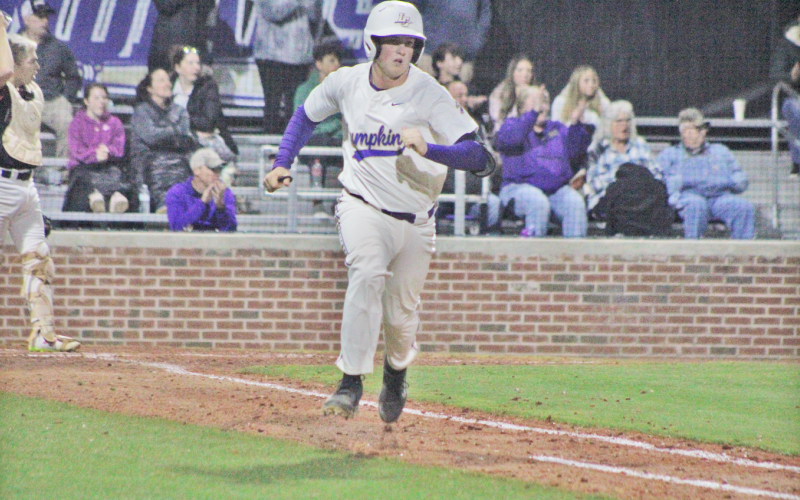 Matthew Mitchell picks up a hit against Flowery Branch.