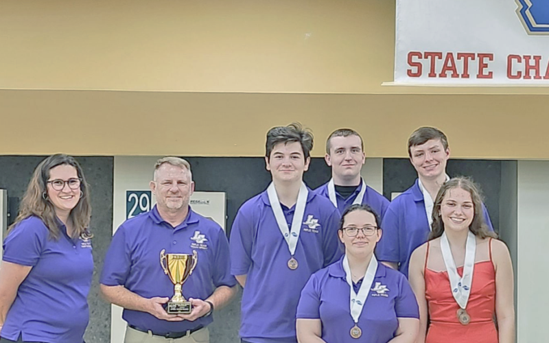 The LCHS Rifle Team took the podium in Waycross to receive their third-place trophy.