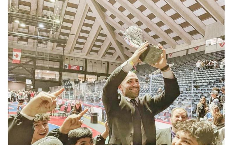 Josh Ghobadpoor celebrates a State Championship alongside his former Gilmer County team.