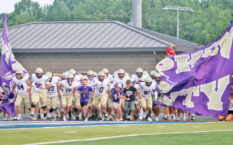 The Lumpkin County High School football team storms the field ahead of their Spring Game.