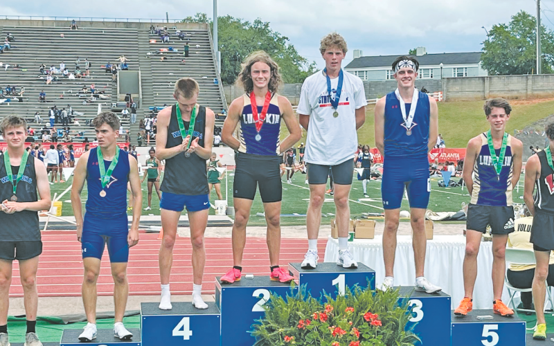 Brothers Wyatt Windham (second) and Witt Windham (fifth) stand on the State Championship podium together.