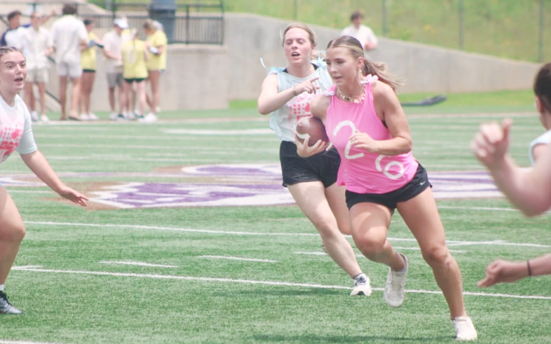Lumpkin softball standout Cadence Ivey plows down the field during the recent powderpuff football game.