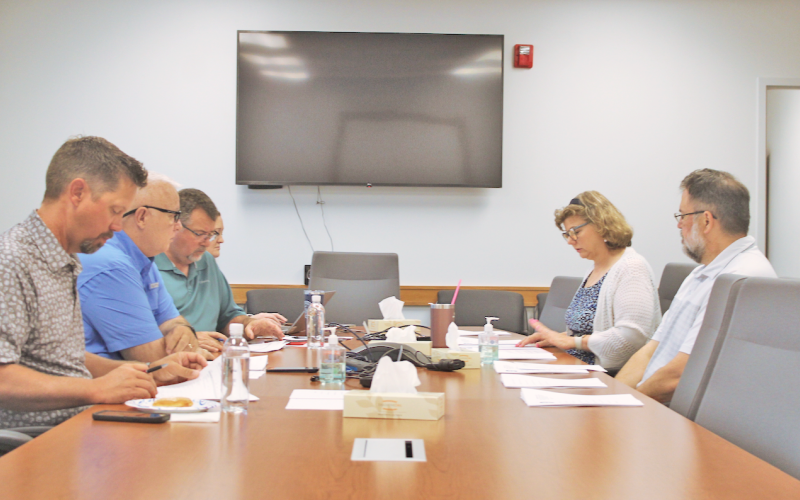 Chestatee Regional Library Director Leslie Clark and Business Manager Jonathan Smith (pictured on right) discuss library operations with the Board of Commissioners during a special session on the 2026 budget.