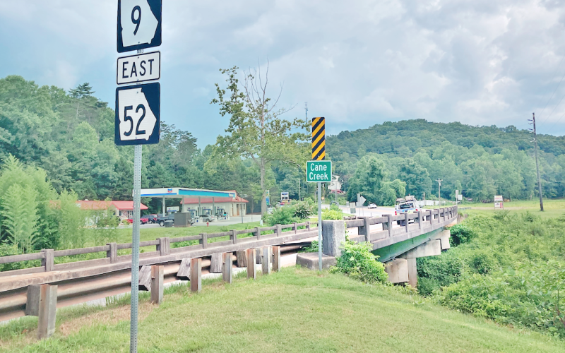 The new DOT plan is to replace two bridges and create two new roundabouts, one at Hwy. 52 and Auraria Road, which will feature bike lane and sidewalk accommodations, and the other at Hwy. 52 and Torrington Drive. An existing bridge on Hwy. 52 will be demolished.