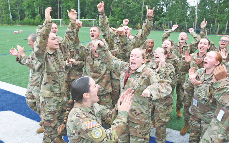 New University of North Georgia cadets congratulate their peers on the successful completion of a team-building challenge on Radar Ridge during FROG Week.