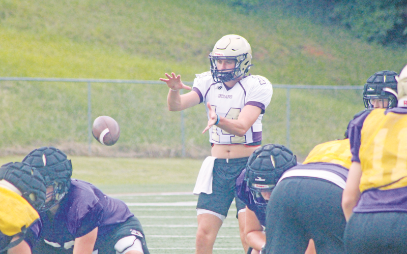 Lumpkin County’s Mason Hester takes a snap during last week’s practice at LCHS.