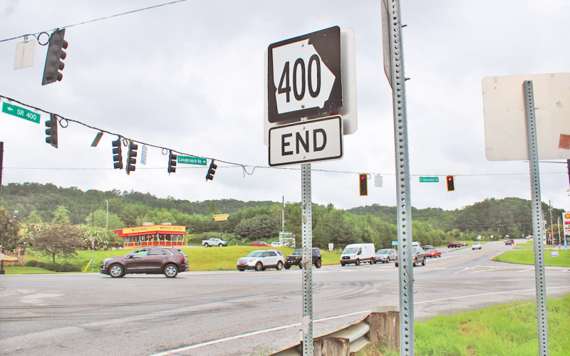 A road sign marking the northern terminus of Highway 400 stands on the future site of a dedicated right turn lane. The Georgia Department of Transportation is expected to break ground on the project later this year to ease congestion at the busy intersection.