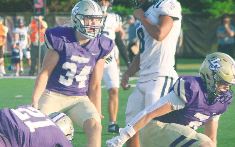 Caleb Wendl celebrates a tackle for a loss of yardage against the Spartans.