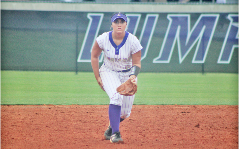 Aubrey Woodson prepares to track down a ground ball for the Lady Indians.