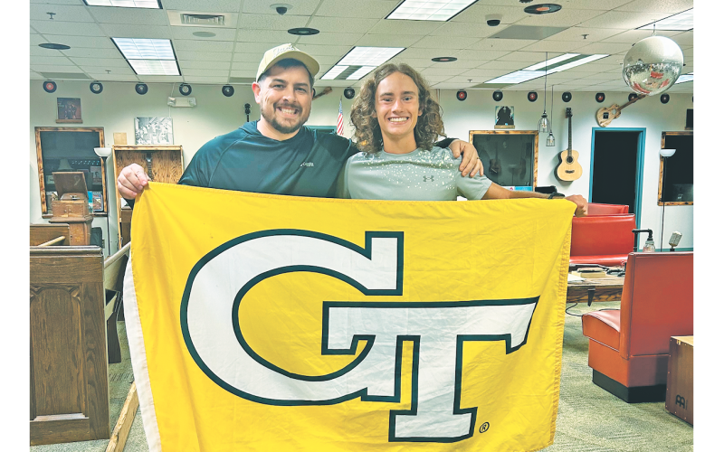 Will Mayfield gifts Wyatt Windham his Georgia Tech flag that flew in Afghanistan while he served in the U.S. Army National Guard.