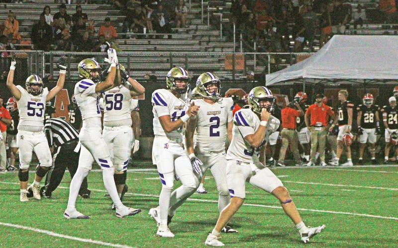 The Indians celebrate after Caleb Wendl (right) secures the game-ending first down over Hart County on the road last Friday.