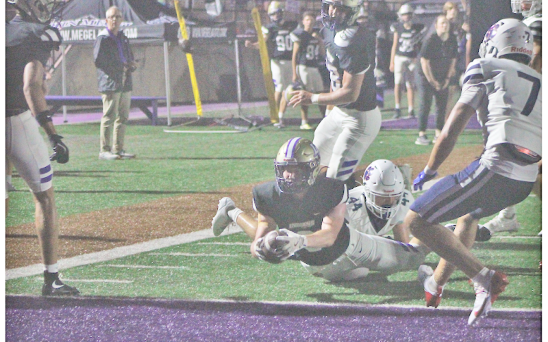 Lumpkin County’s Nolan Matthews dives into the end zone for an Indians touchdown versus Dunwoody.