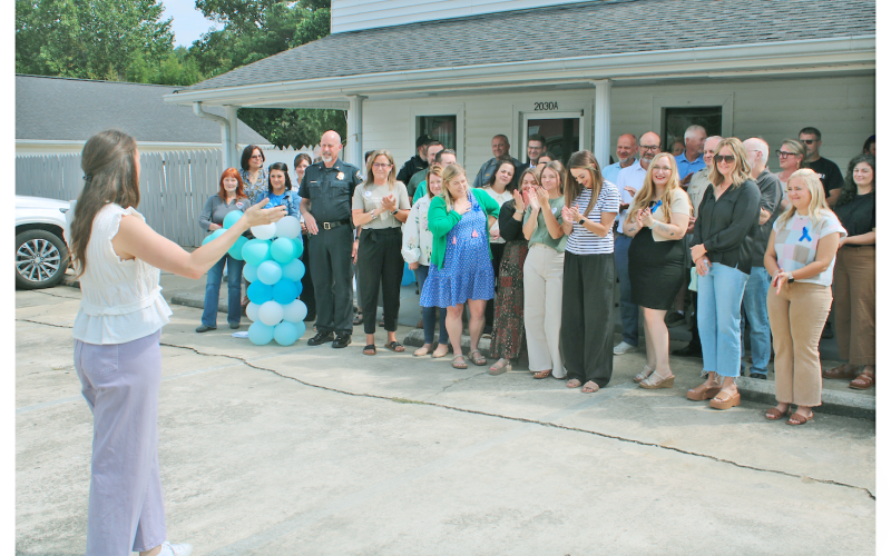 South Enotah Child Advocacy Center Executive Director Rebekah Perethian speaks to a crowd of donors, volunteers and well-wishers at the grand opening for the non-profit’s new Dahlonega location.