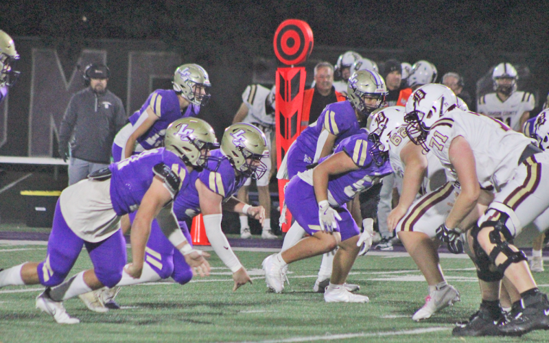 Lumpkin County’s defensive line faces off with Dawson’s offense.