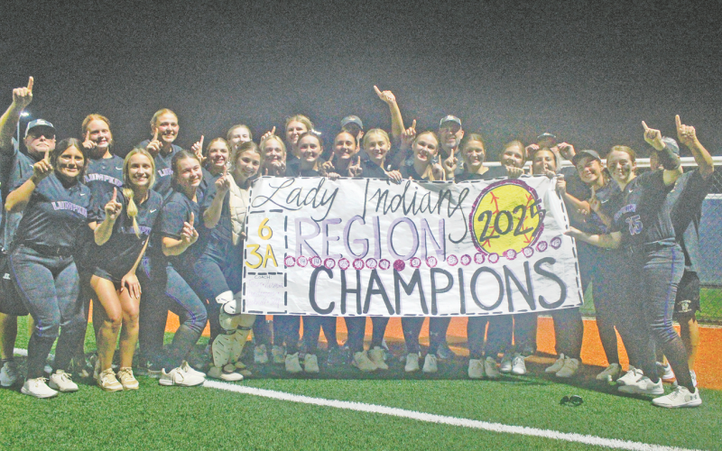 The Lady Indians softball team celebrates its Region Championship, following the big win over White County.