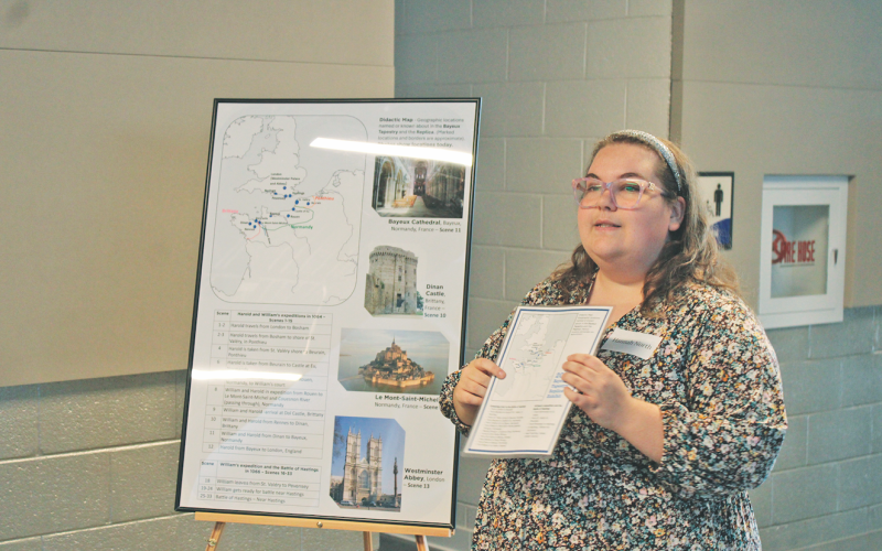 University of North Georgia art student Hannah North shows a map featuring some of the famous historical locations referenced in the Bayeux Tapestry.