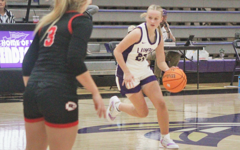 Anna Davis drives down the court for the Lady Indians.