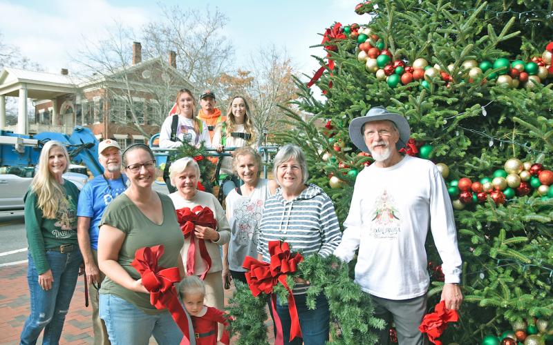 A team of volunteers from the Old Fashioned Christmas Committee, along with City of Dahlonega employees, adorned the downtown tree with homemade decorations. Big crowds are expected in downtown Dahlonega for the annual Lighting of the Square this Friday. Local activities will last throughout the Christmas season.