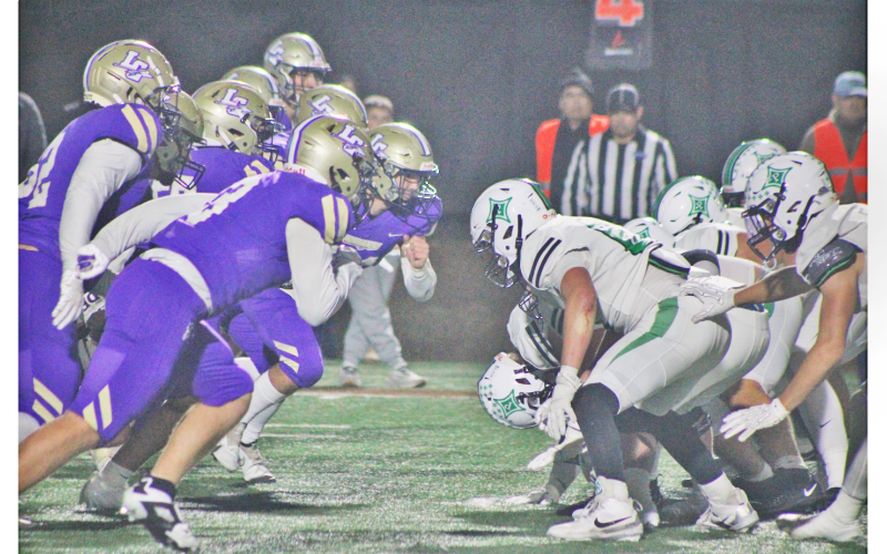 Lumpkin County’s defense charges at the Pickens offensive line during a fourth down play in last week’s matchup.