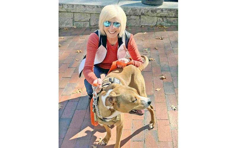 Diana Dunetz, co-founder of the Run for the Rescues 5K, with Lumpkin County Animal Shelter resident Bishop, who is looking for his forever home.