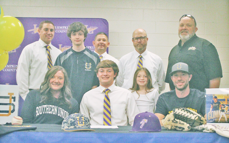 Mason Hester attends his signing day surrounded by coaches, friends and family.
