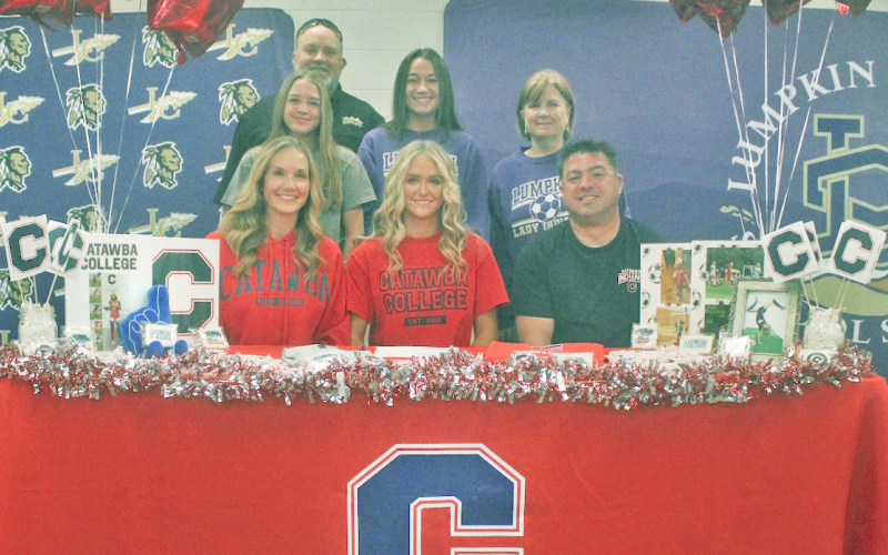 Lumpkin County soccer senior standout Kaitlyn Johnson celebrates her college signing with her family and coaches.