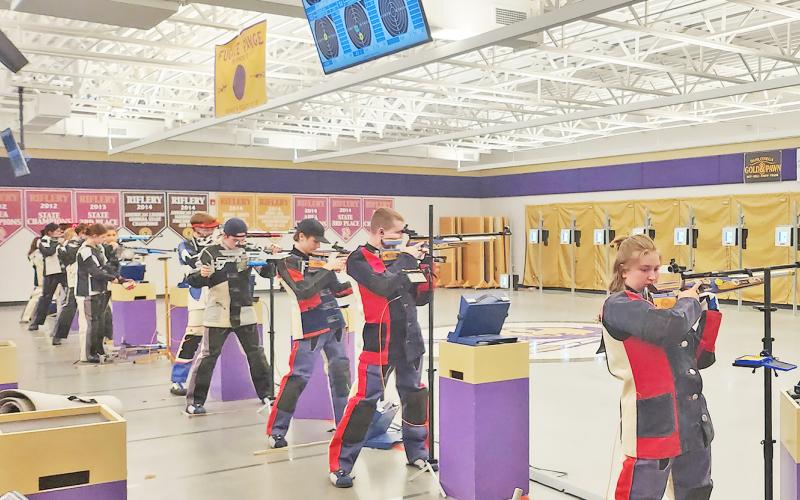 The LCHS rifle team takes aim during a recent match.