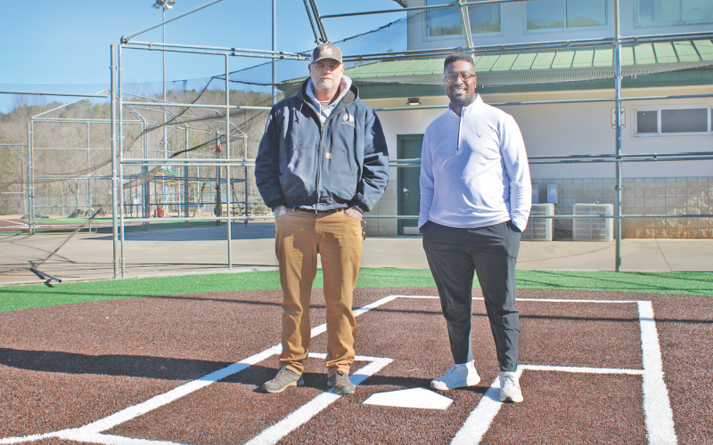 Lumpkin County Parks &amp; Rec Field Maintenance Supervisor Steve Cuny (left) and Athletic Director Ahmad Kamara stand at home plate on one of two renovated Cloverleaf ballfields, which feature artificial turf infields and natural grass outfields.