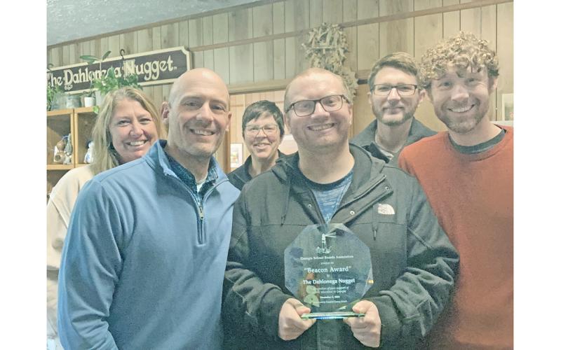 The Dahlonega Nugget was honored to receive a 2025 Beacon Award from the GSBA. Pictured, from left, are Office Manager Chauna Utterback, Editor/Publisher John Bynum, Advertising Consultant Erin Riley, Sports Reporter Eligha Roper, Staff Writer Keith Murden and Executive Editor Matt Aiken.