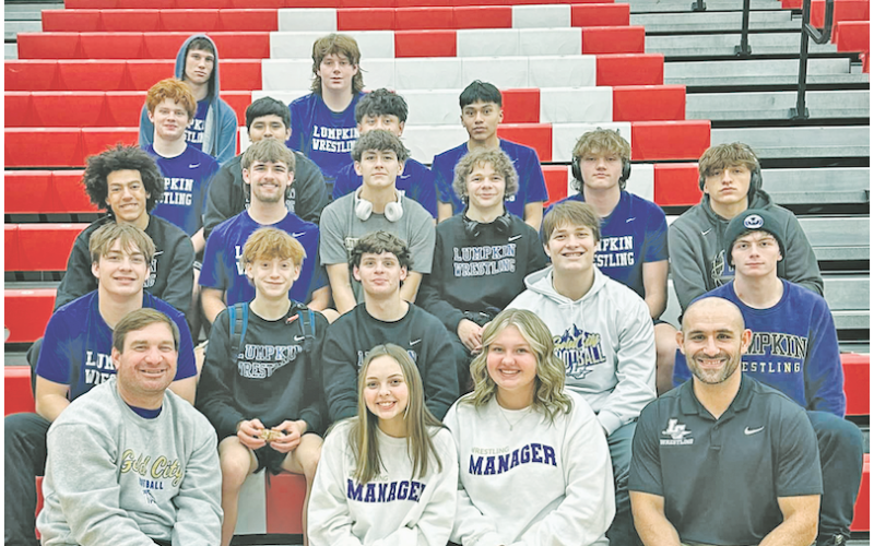 The Lumpkin County boys’ wrestling team celebrates their win following the Morgan County Duals.